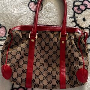 Gucci Boston Bag in Iconic GG monogram canvas with red leather trim